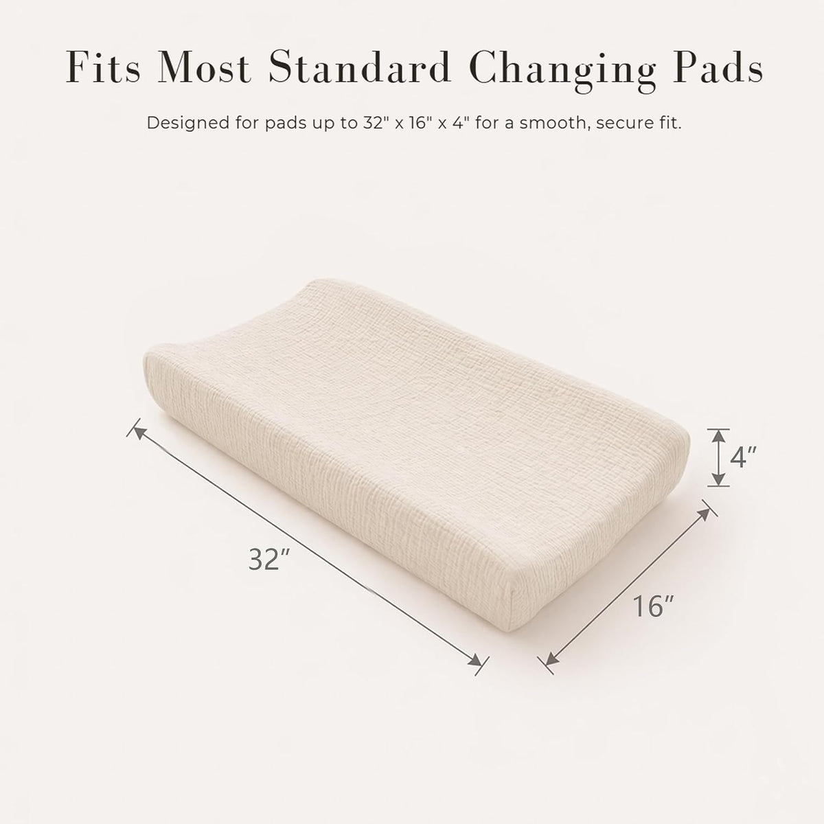 Changing pad cover in cream/off-white muslin fabric shown on a contoured pad from a three-quarter angle. Dimension arrows indicate 32" long, 16" wide, and 4" tall. Text reads 'Fits Most Standard Changing Pads.'