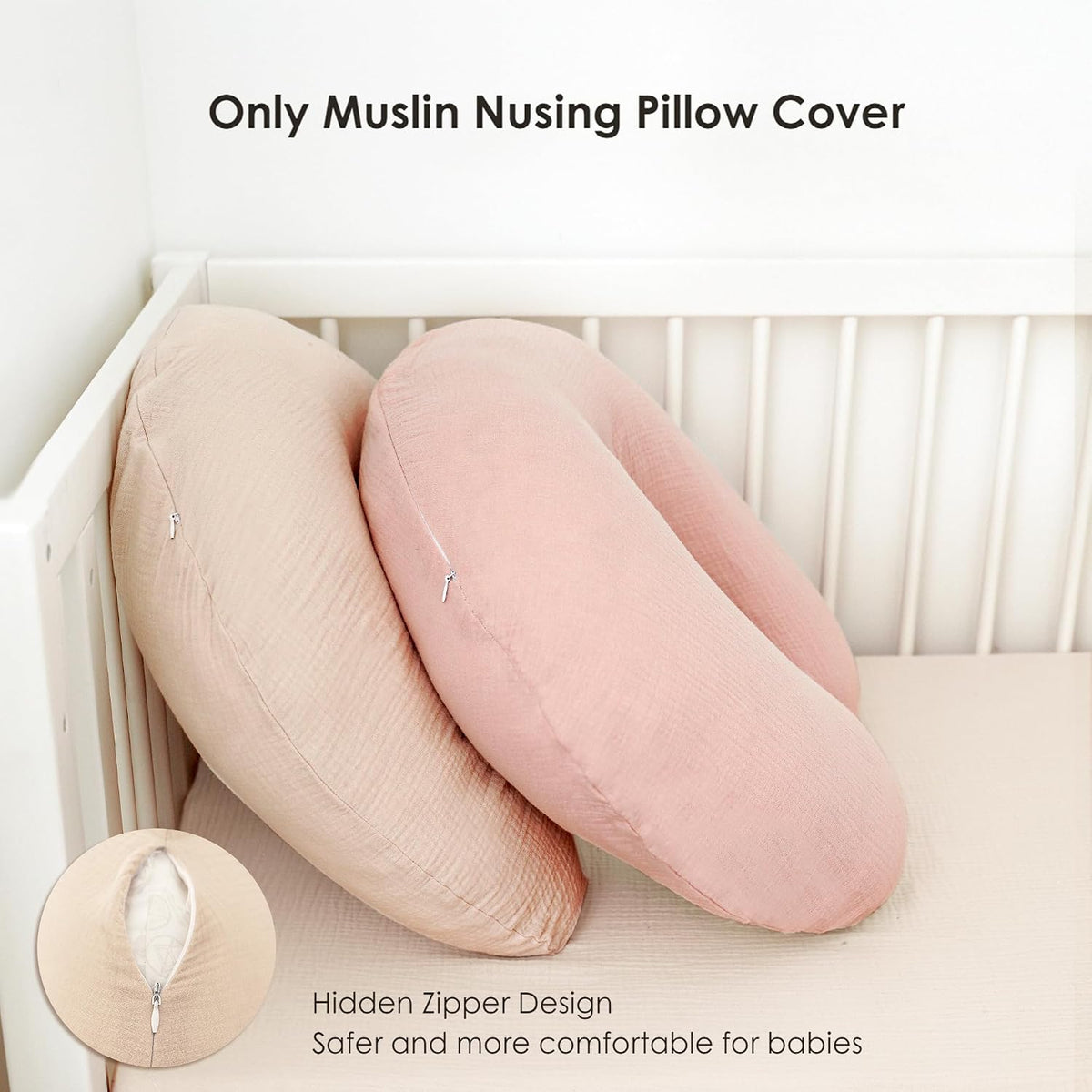 Two crescent-shaped muslin nursing pillow covers leaning against a white crib -- one beige, one dusty pink. Both show a subtle woven texture and a small zipper closure. A close-up inset highlights the hidden zipper design.