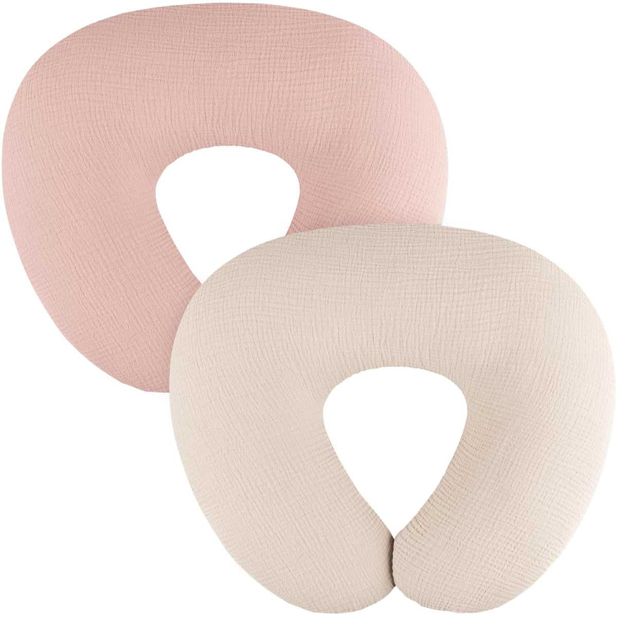 Two U-shaped nursing pillow covers in dusty pink and cream, shown overlapping on a white background. Both feature a subtle woven muslin texture and a U-shaped opening at the bottom.